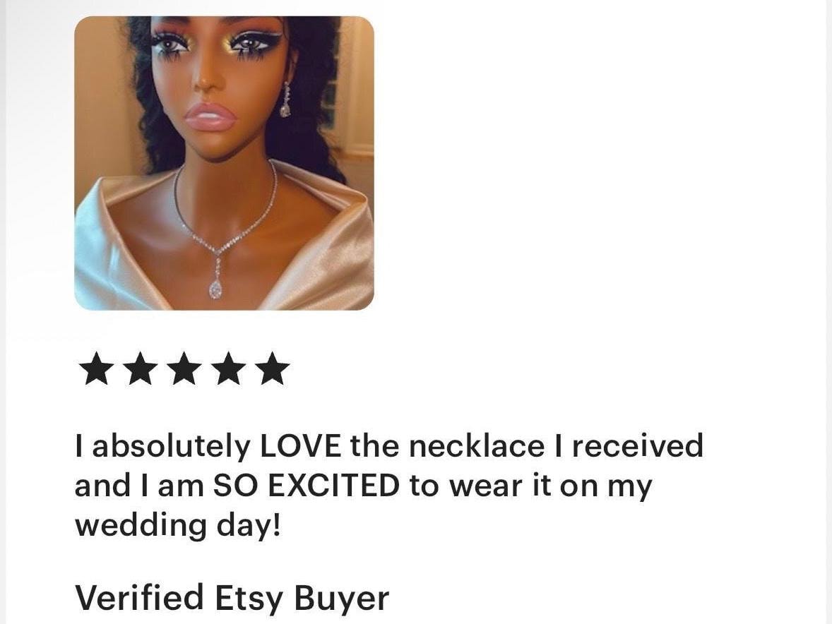 A five star customer review of the sparkly silver jewelry set stating that they absolutely love the necklace and earring set they recieved and they are excited to wear them on their wedding day.