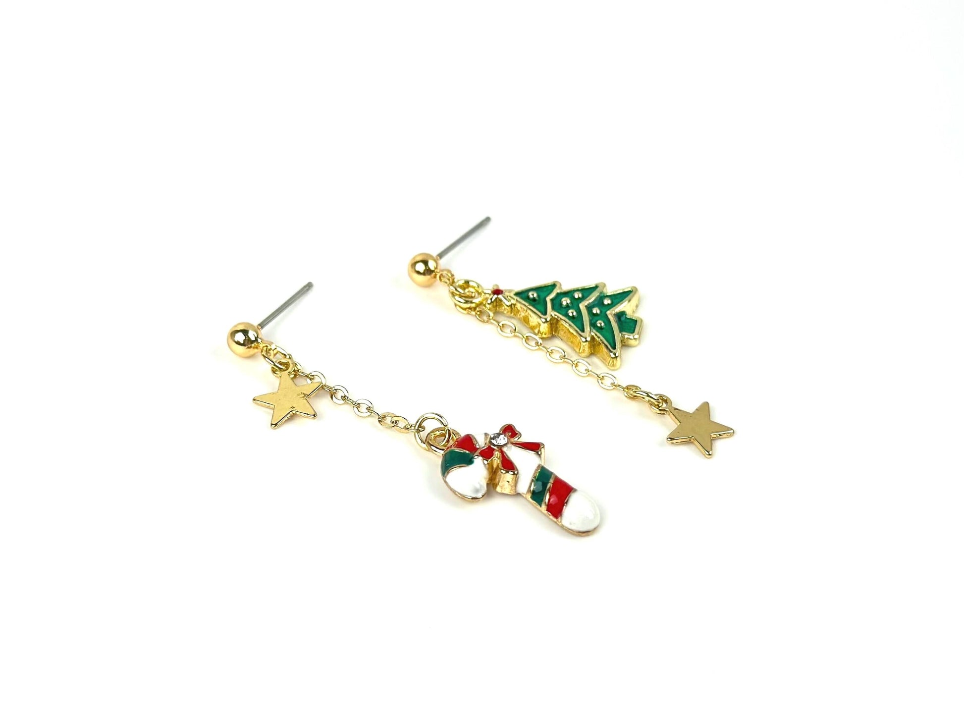 mismatched dangle earrings, about 2 inches long, one earring with white green and red candy cane and gold star charm and the other earring with green Christmas tree and gold star charm